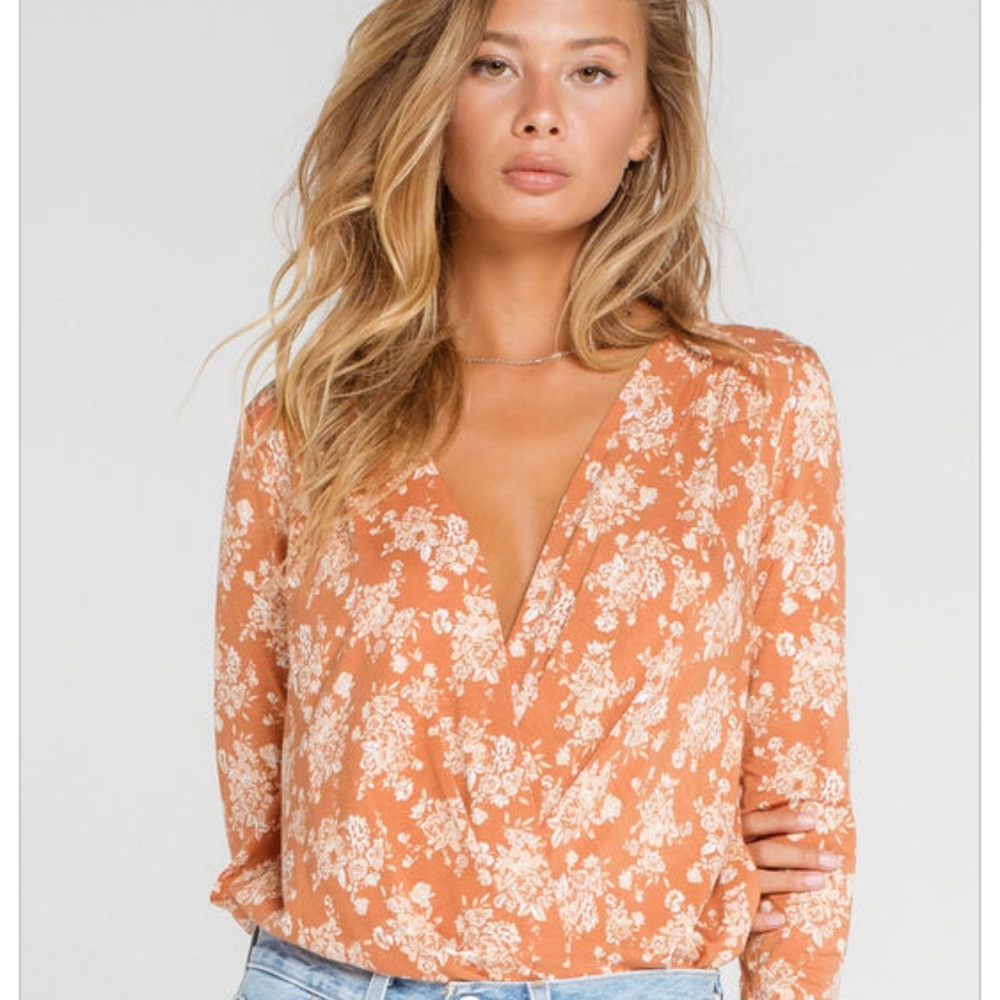 Free people turnt floral body suit in rust color